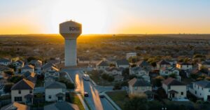 Established suburban homes on a tree-lined street in Schertz, TX