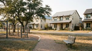 Family homes and a community park in a New Braunfels, TX neighborhood
